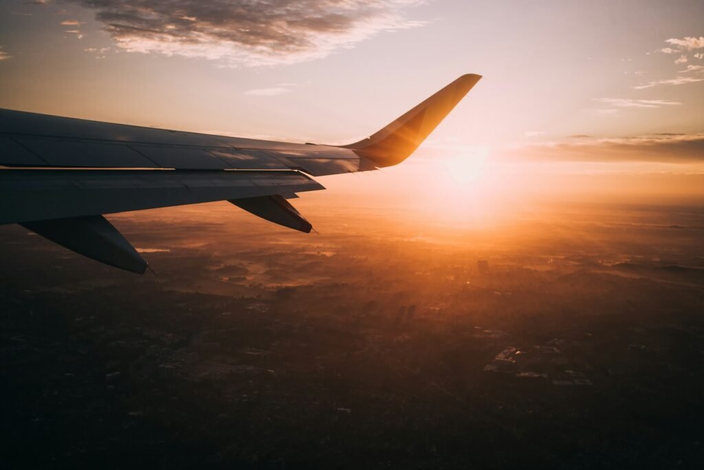 View of an airplane wing at sunset