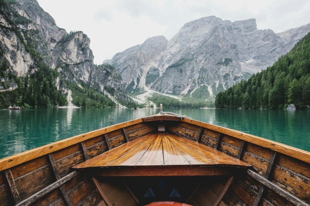Wooden boat on a turquoise mountain lake