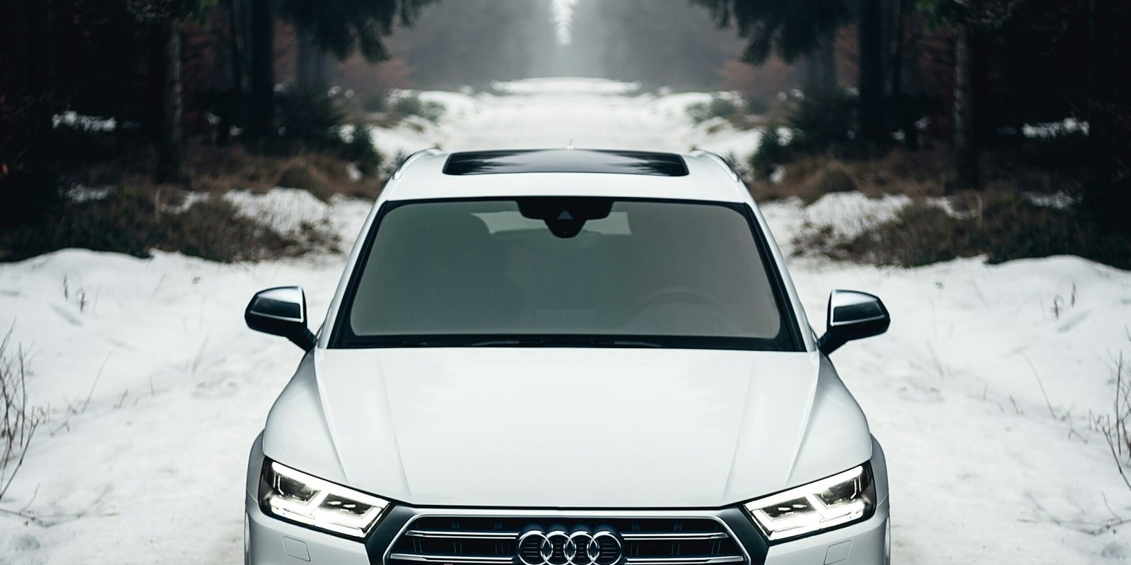 SUV rental car on a snowy mountain road in winter