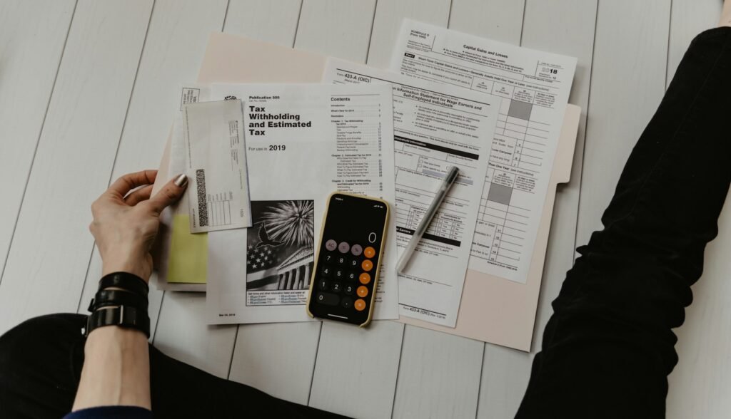 Calculator and paperwork for planning a trip budget